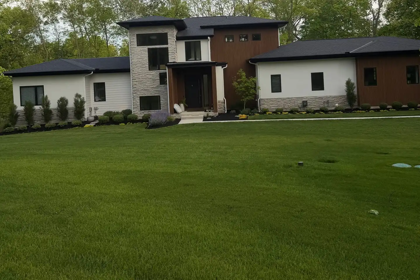 Newly laid sod lawn in front of a modern home